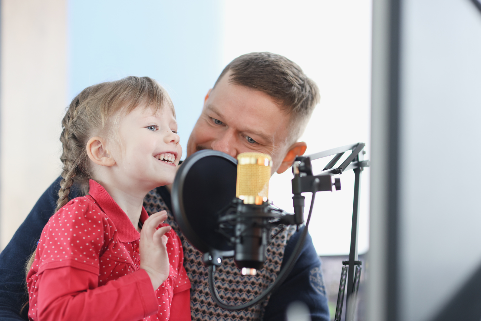 Man and Girl Are Recording Their Voice on Microphone