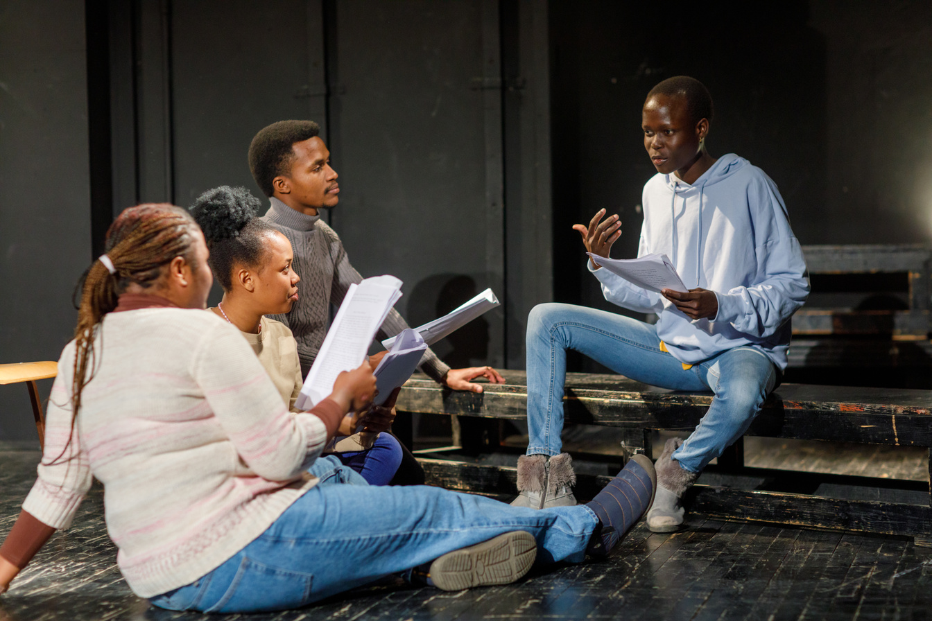 Group Of Black Drama Students Doing An Improv Exercise In An Acting Class